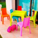 Conjunto Infantil Julieta con mesa roja y 4 sillas multicolor para niños.